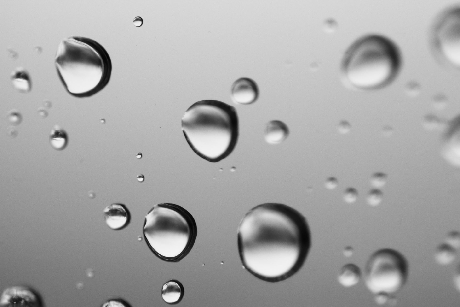 Water droplets resting on glass