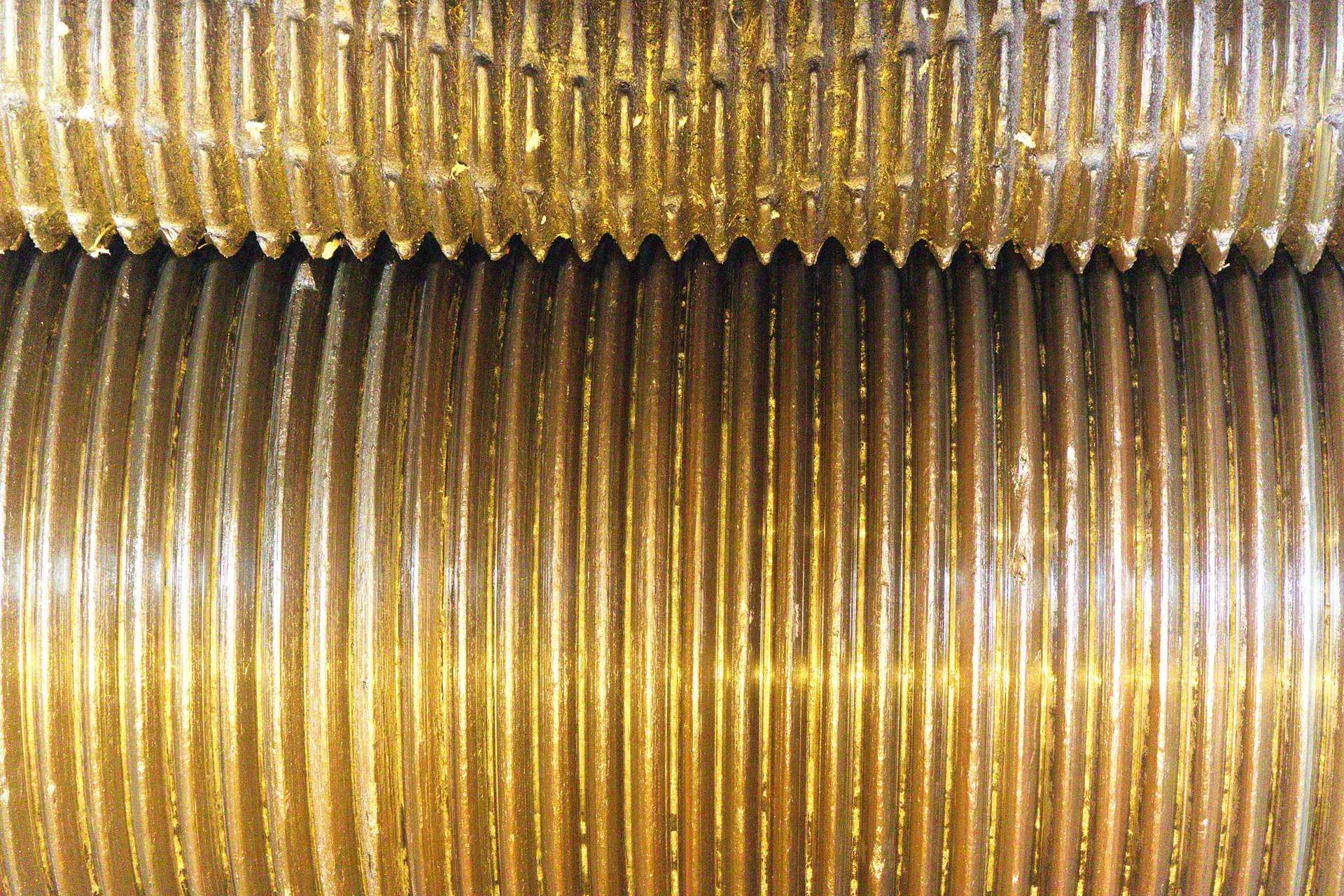 Two ribbed metal rollers, close up
